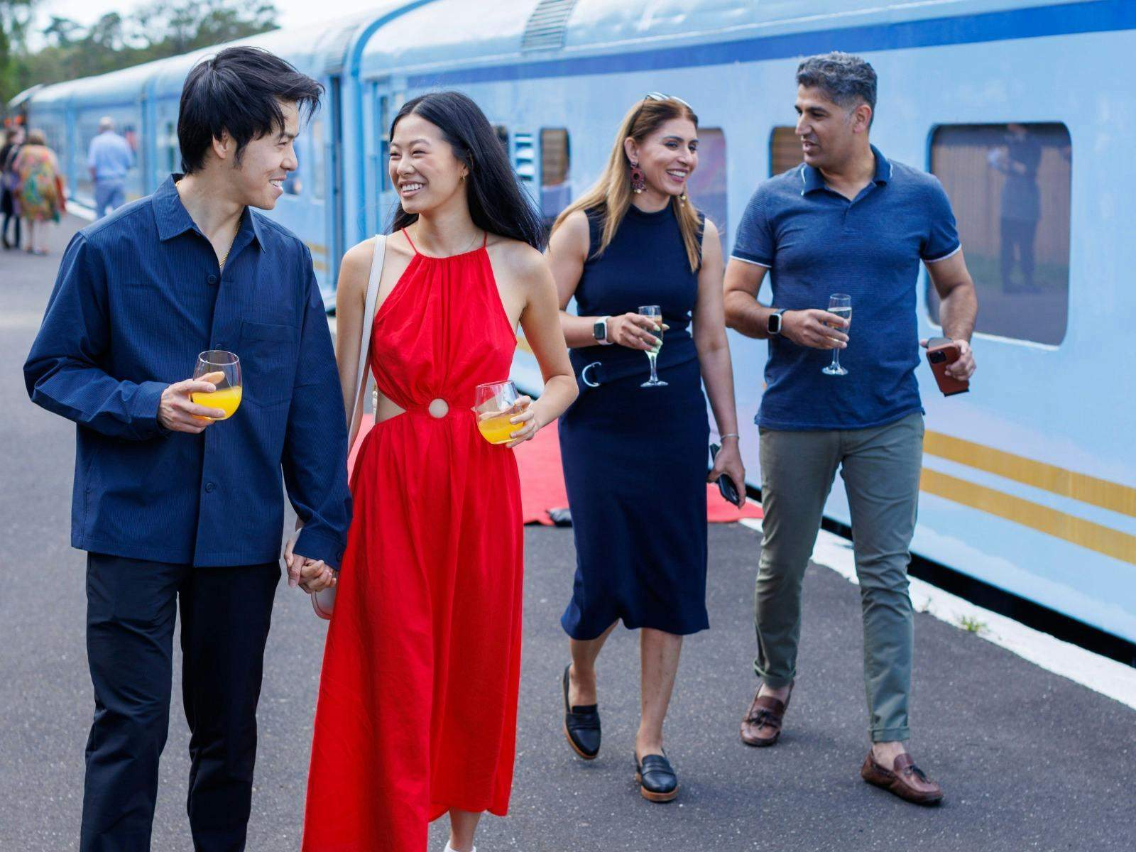 Guests beside The Q Train at the station