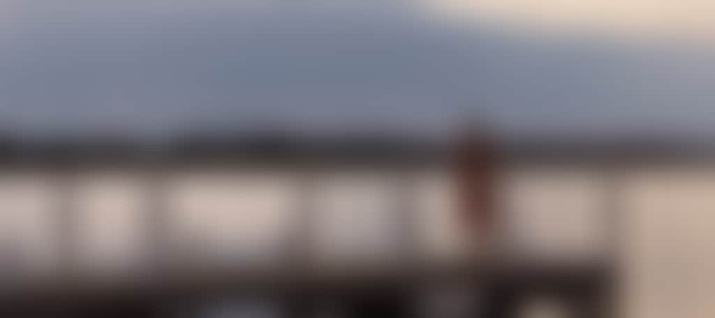 Girl standing on Paynesville jetty at sunset