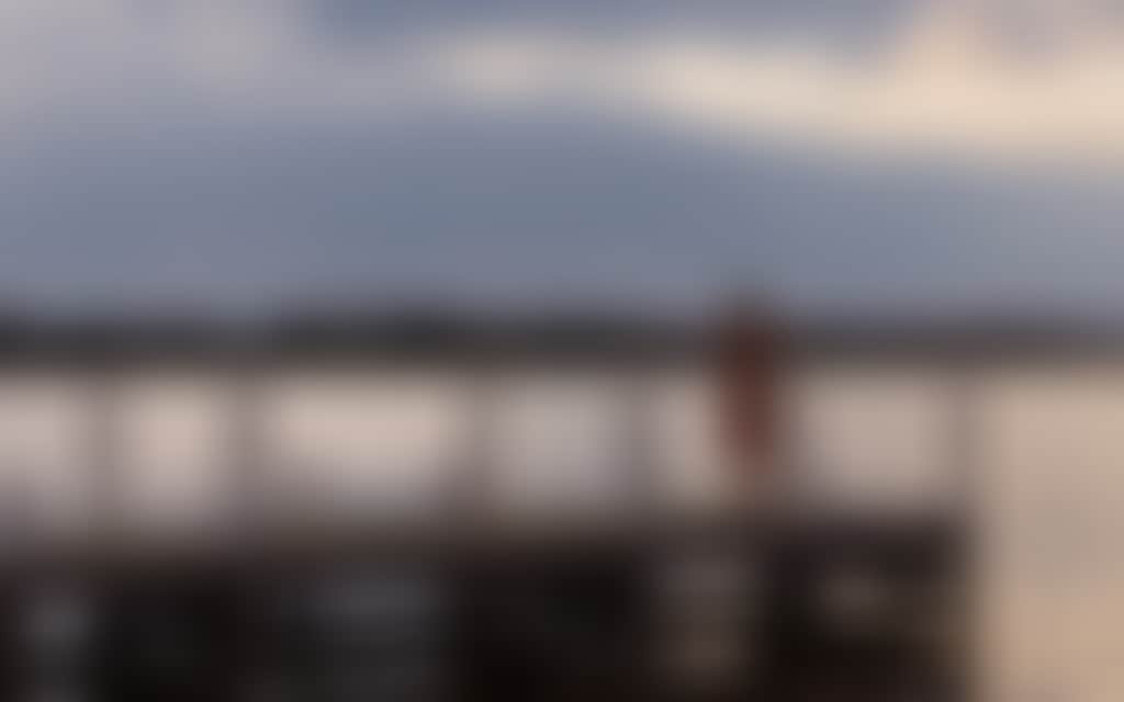 Girl standing on Paynesville jetty at sunset