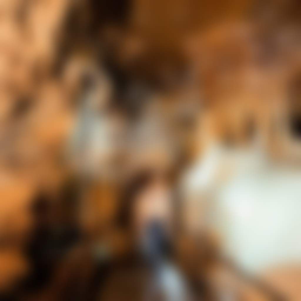 Buchan Caves girl walking along platform through caves