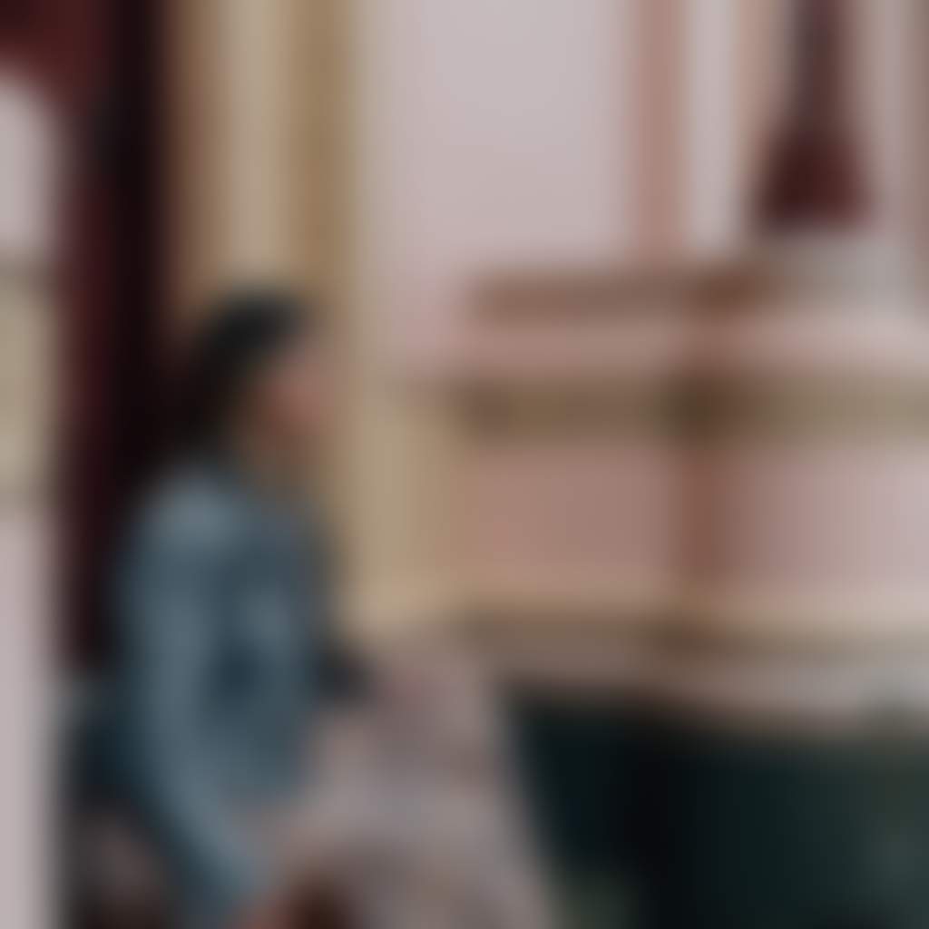 Sale lady sitting on steps of heritage building