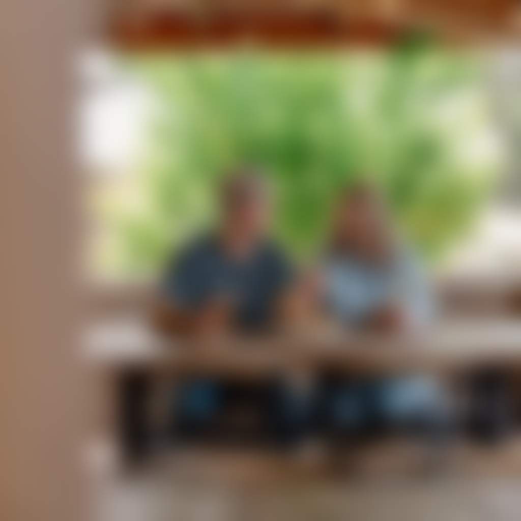 Couple eating on the porch at Buchan Caves Hotel