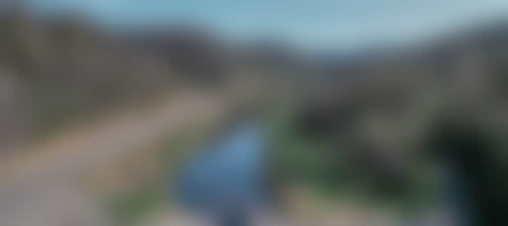 Great Alpine Road car driving over Tambo River aerial shot