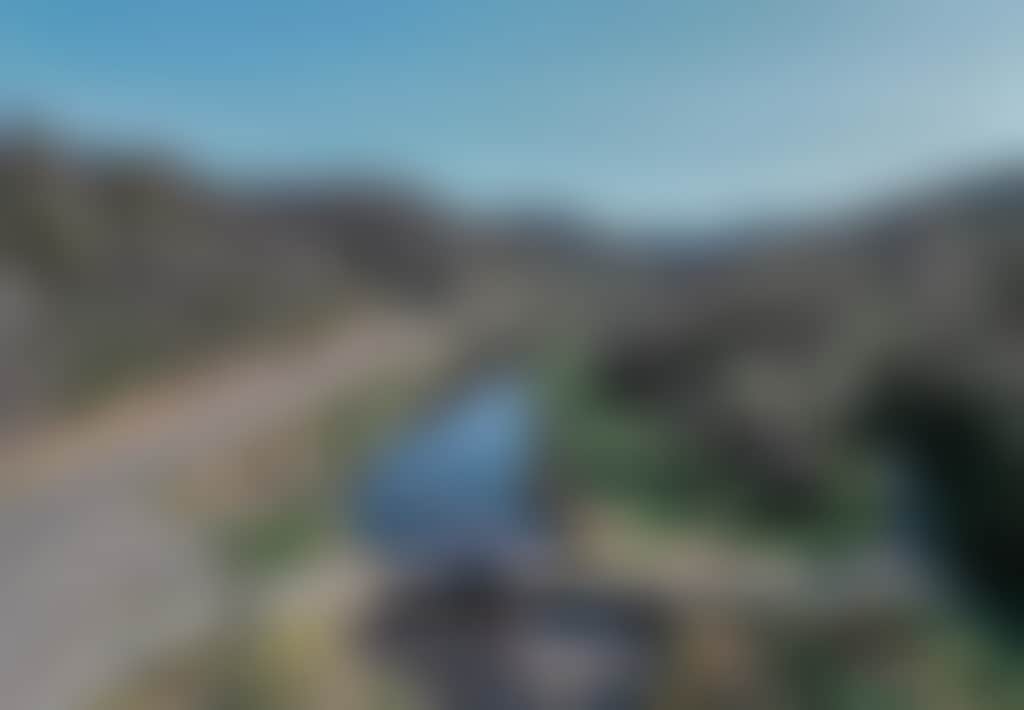 Great Alpine Road car driving over Tambo River aerial shot