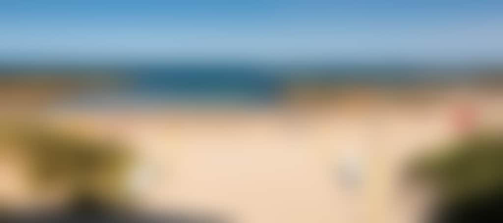 Cape Paterson foreshore beach with surf life saving flags