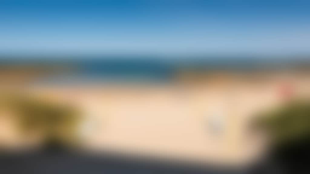 Cape Paterson foreshore beach with surf life saving flags