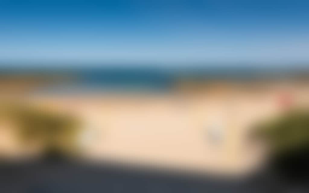 Cape Paterson foreshore beach with surf life saving flags