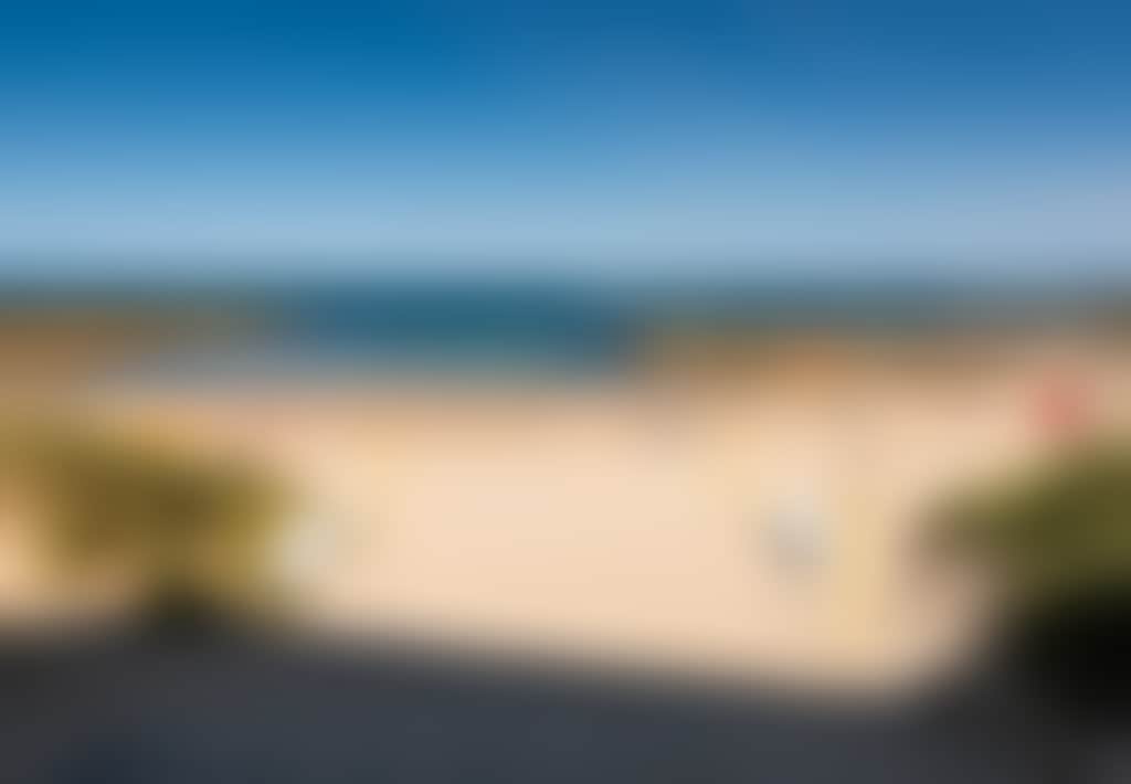 Cape Paterson foreshore beach with surf life saving flags