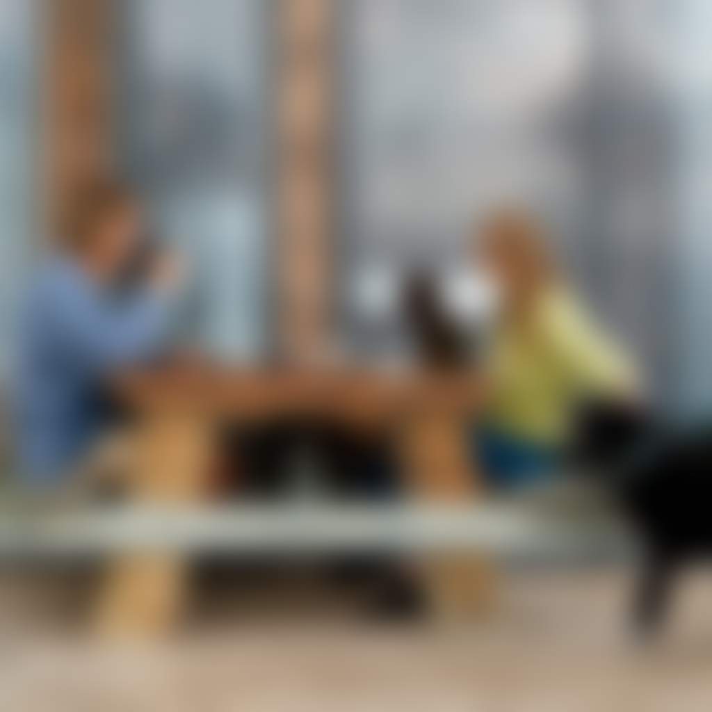 Gurneys Cider couple with dog at picnic table outside