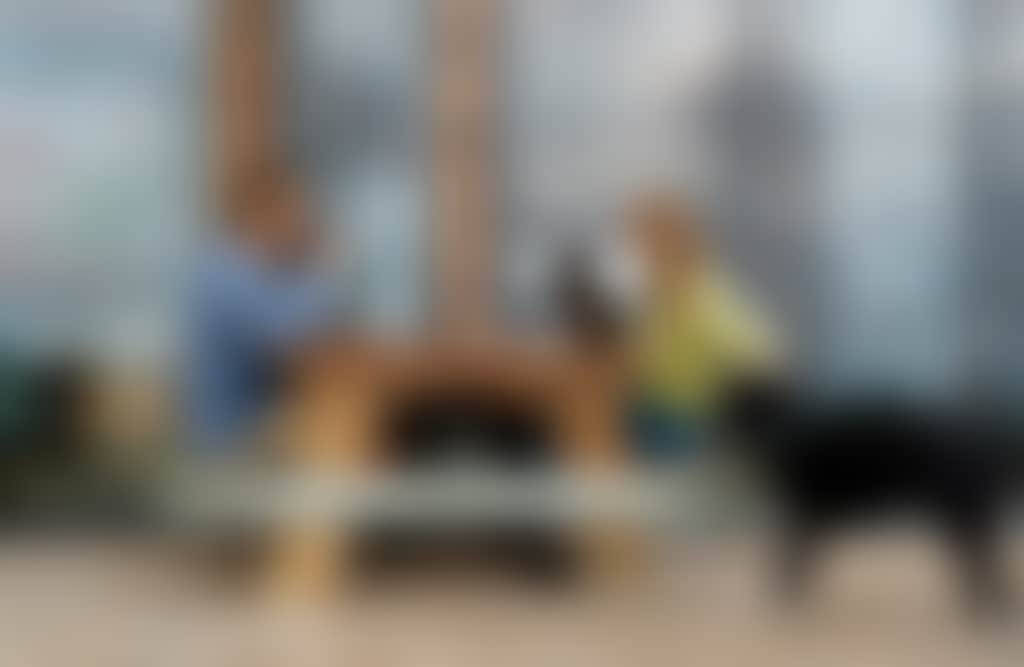 Gurneys Cider couple with dog at picnic table outside