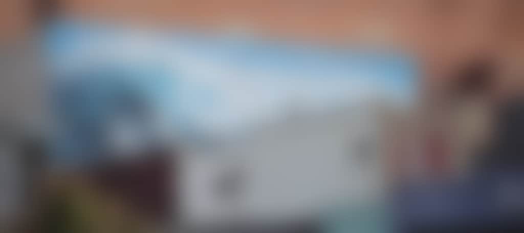 Dolphins in wave mural Wynnes building Yarram