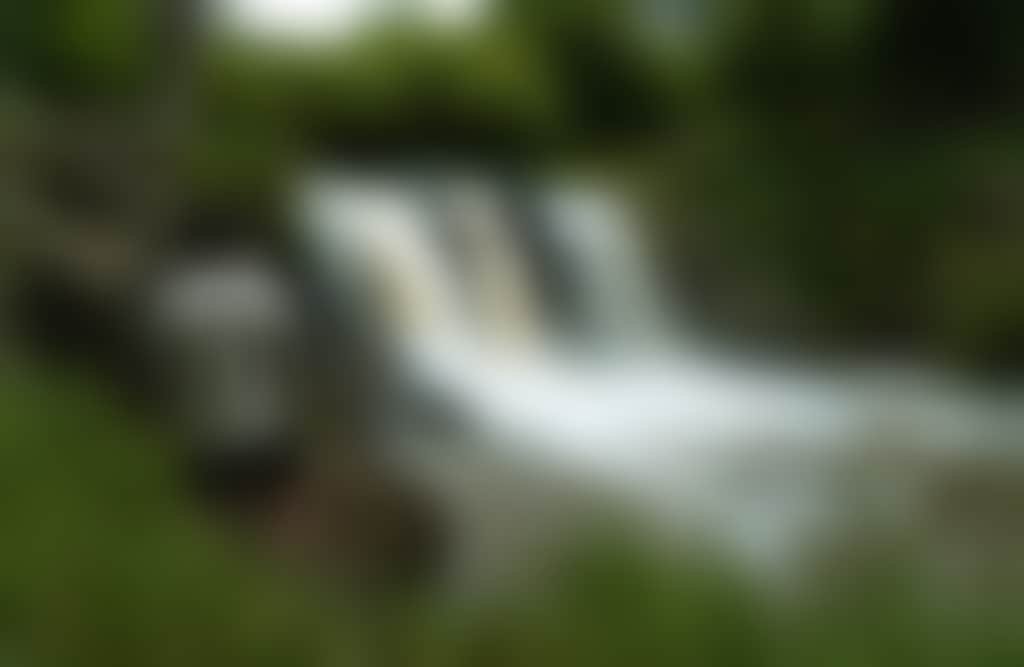 Narracan Falls man standing in front of waterfall at picnic area