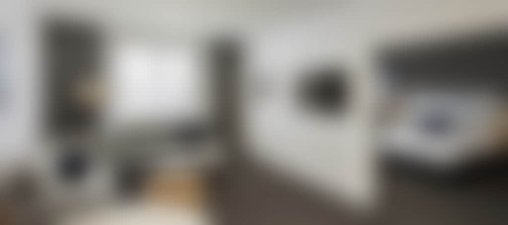 Mantra Traralgon guestroom with living area and bedroom