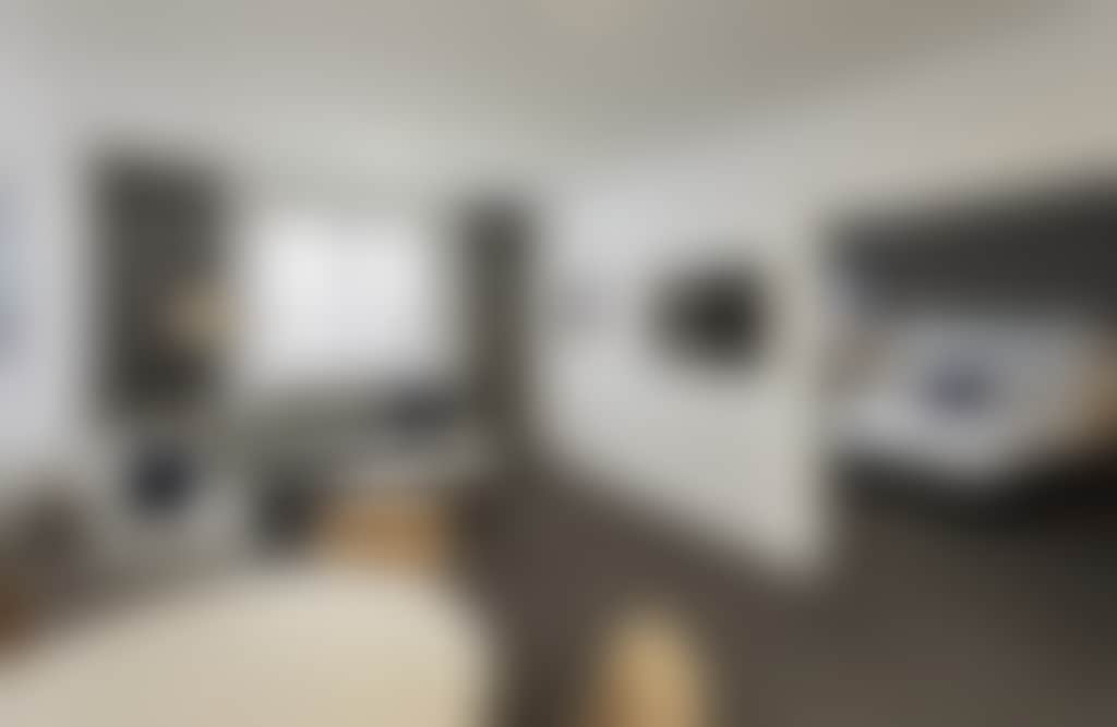 Mantra Traralgon guestroom with living area and bedroom