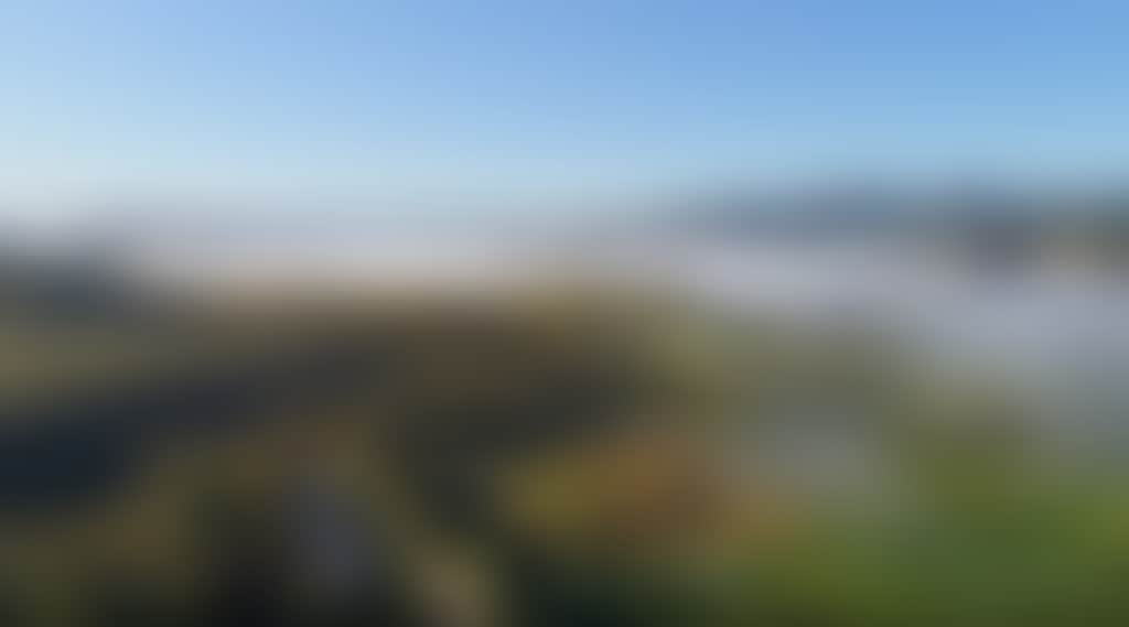 Buchan aerial view of town and mist in valley