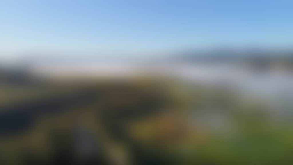 Buchan aerial view of town and mist in valley