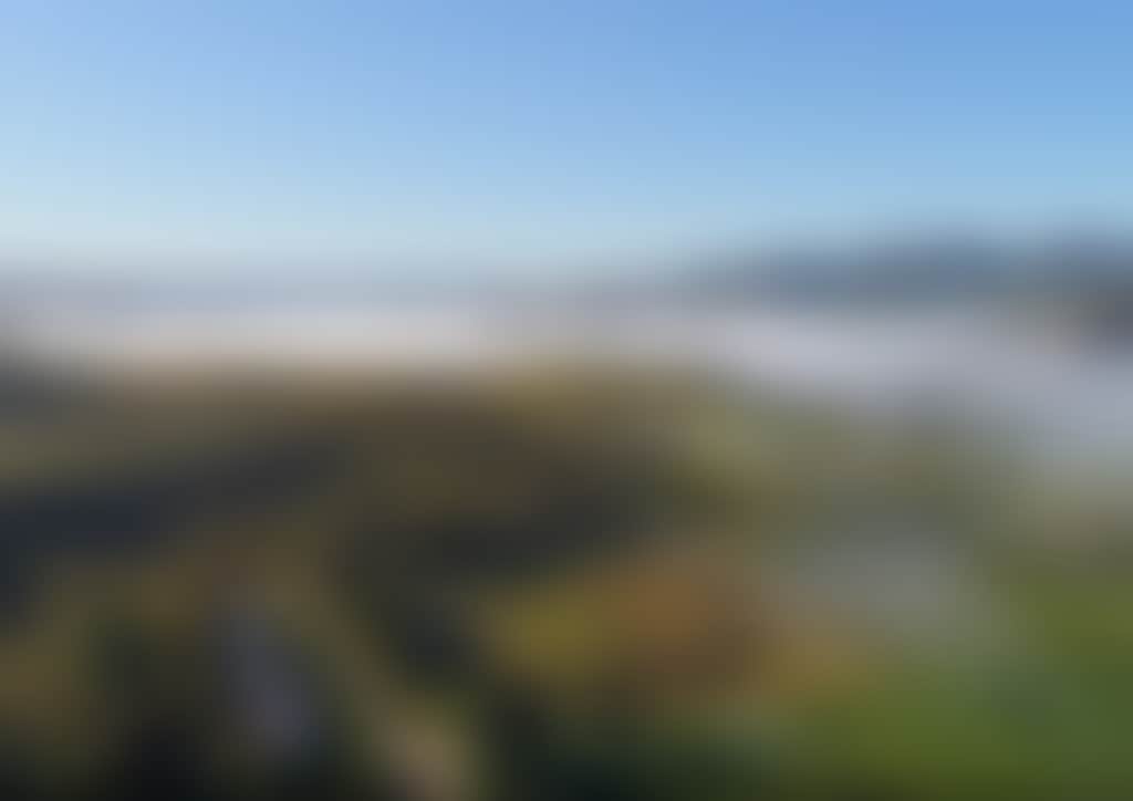 Buchan aerial view of town and mist in valley
