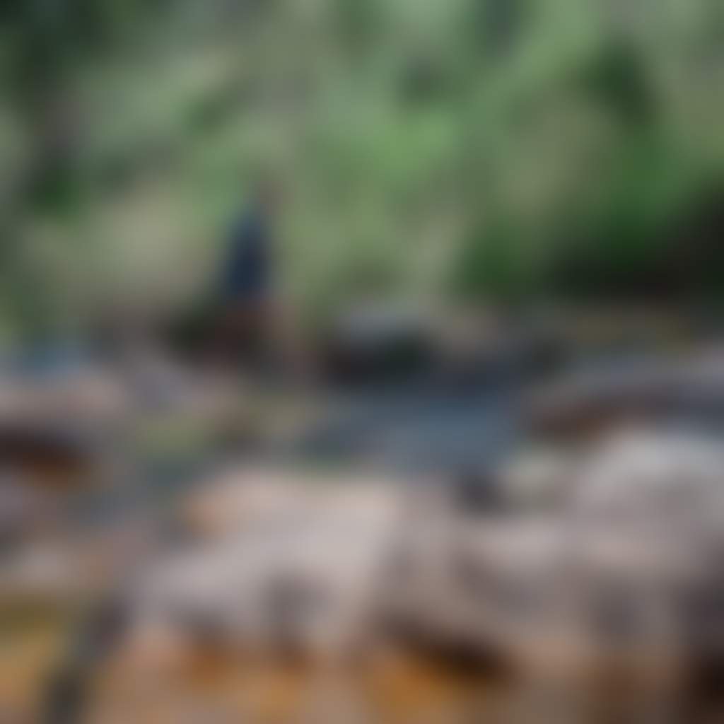 Woman crossing river at W Tree Falls near Buchan