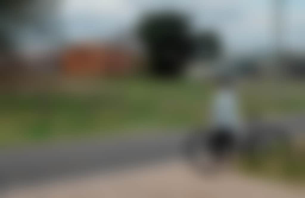 Mossiface Hops Kilns Bruthen cyclist stops to admire building