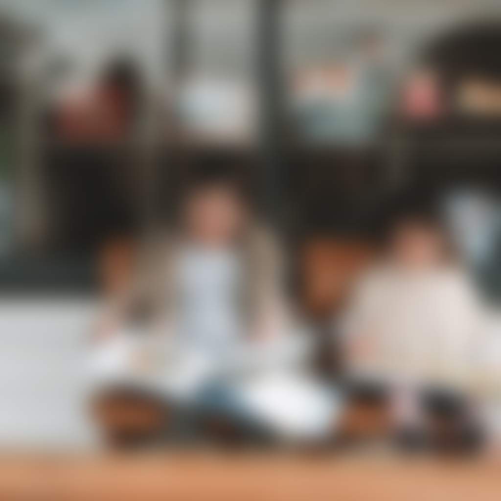 Alison Lester Gallery Fish Creek two children sitting outside store reading picture books