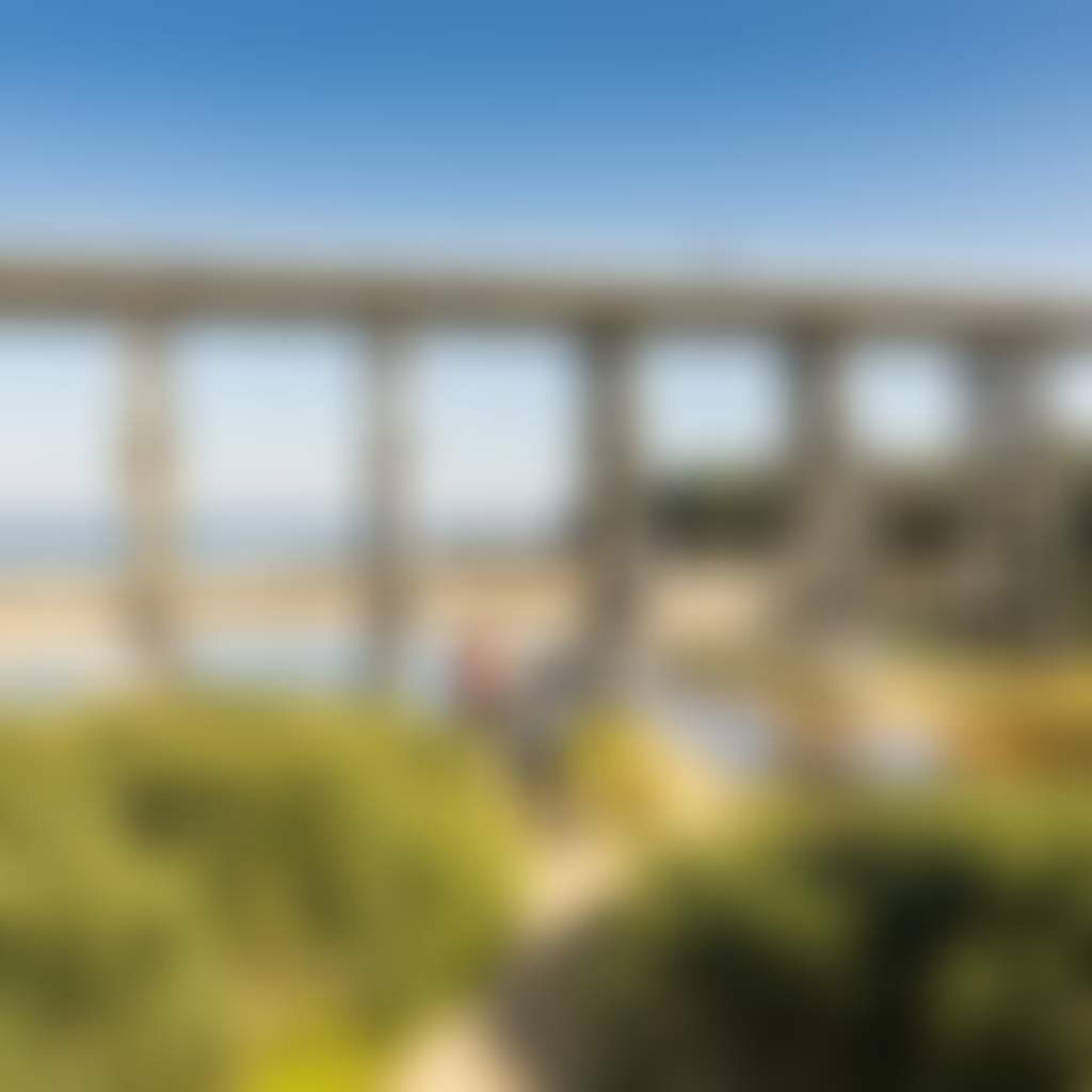 People walking next to river under Kilcunda Trestle Bridge