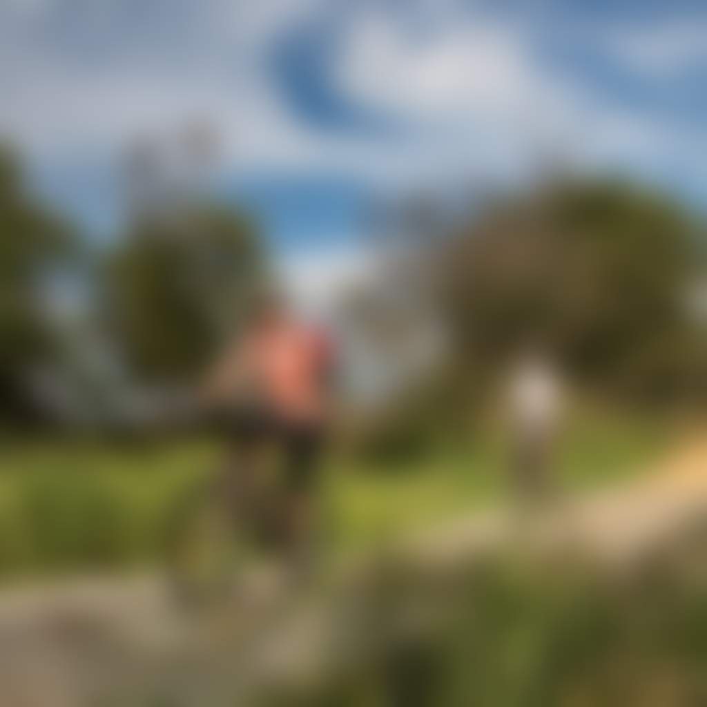 Cyclists riding over small bridge Gippsland Plains Rail Trail