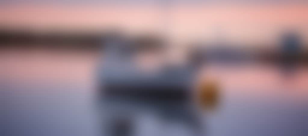 Mallacoota boat on the water at sunset