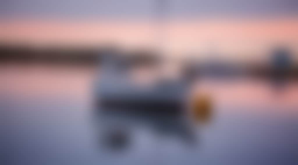Mallacoota boat on the water at sunset