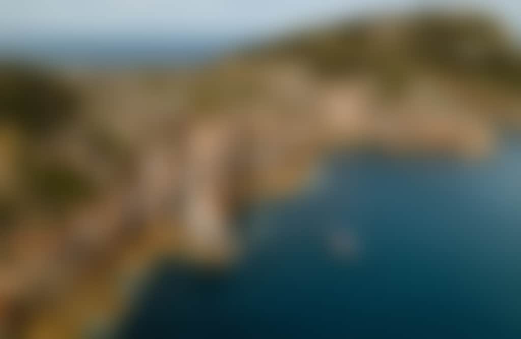 Wanderer Adventures Wilderness Cruise aerial image of boat by rock formations