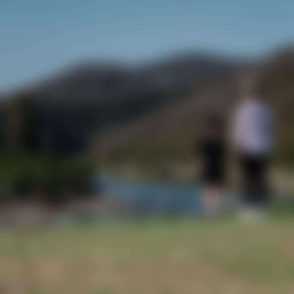 Mother and child overlooking the river at Balley Hooley aka the Junction near Buchan