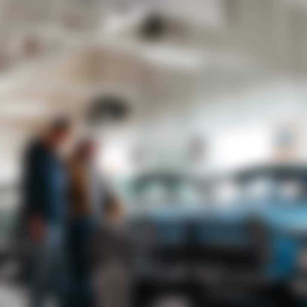 Trafalgar Holden Museum family looking at vintage blue cars display