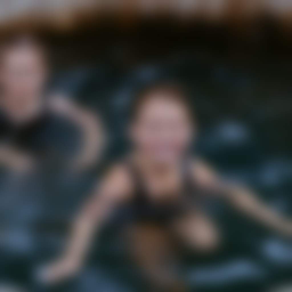 Two kids in a bathing barrel at Metung Hot Springs