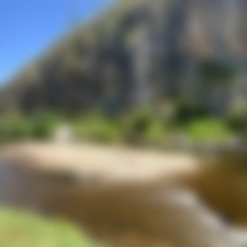 The Bluff Reserve Buchan lady walking on rock island swimming