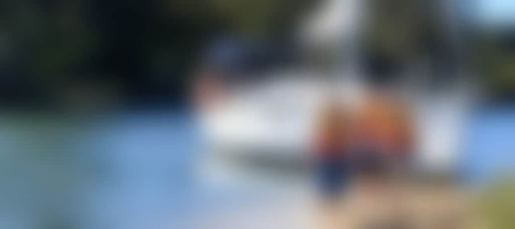 Three children next to a sailing Boat Lakes East Gippsland