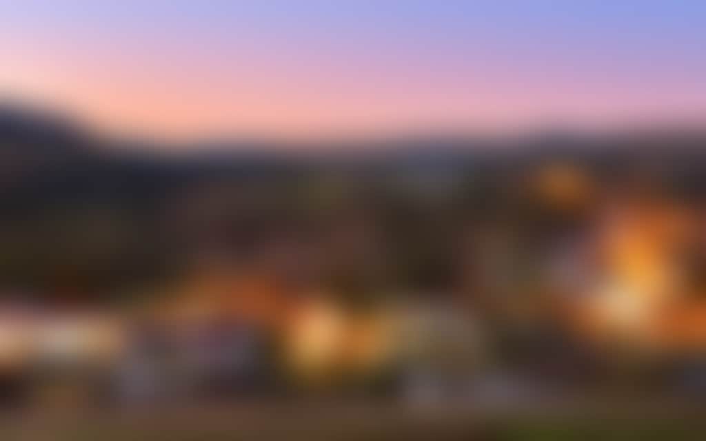 Omeo Great Alpine Road view of the town lit up at twilight