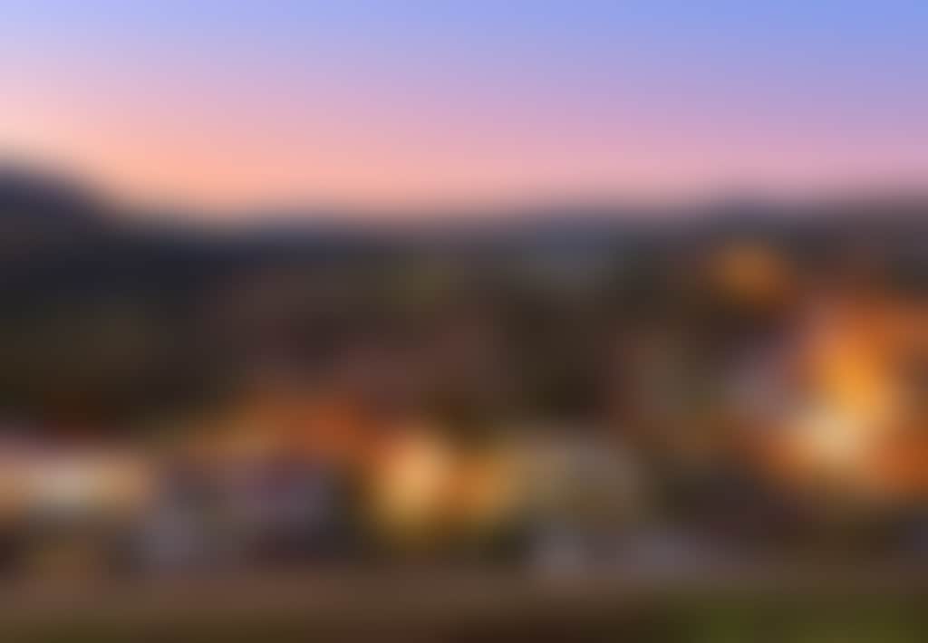 Omeo Great Alpine Road view of the town lit up at twilight