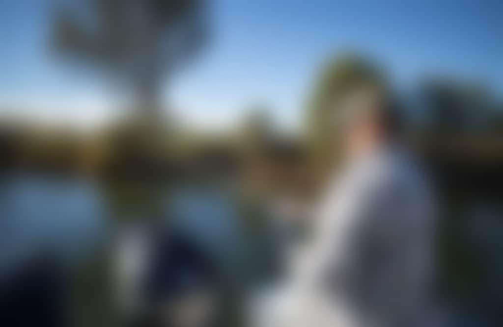 Lakes Entrance man fishing from boat on the water