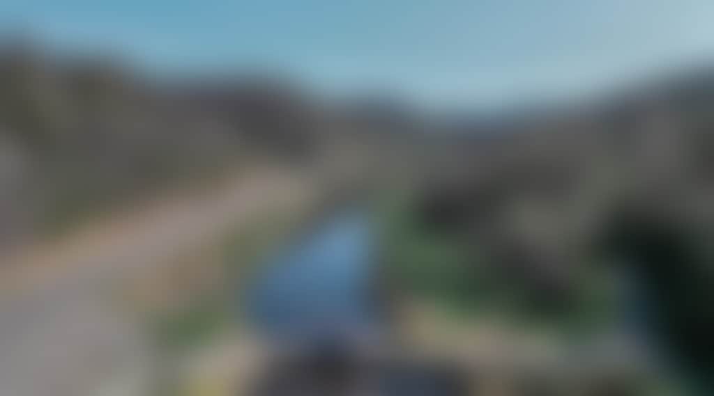 Great Alpine Road car driving over Tambo River aerial shot
