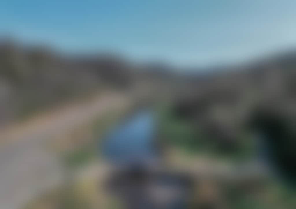 Great Alpine Road car driving over Tambo River aerial shot