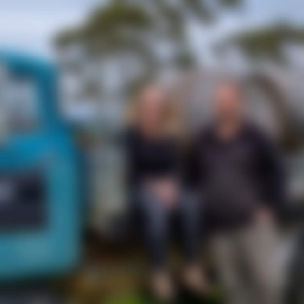 Harman Wines Wattle Bank harman family sitting on blue truck with wine barrells