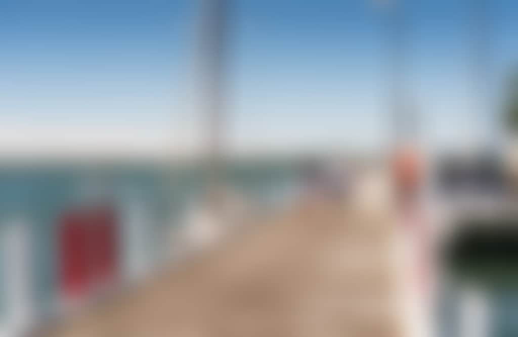 Port Albert Couple walking along wharf holding hands