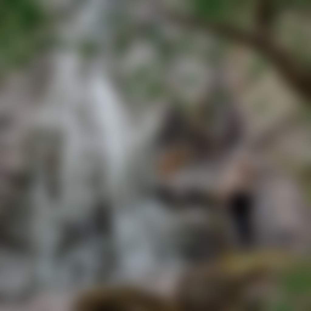 Basin Creek Falls girl standing on rock at waterfall in Snowy River National Park