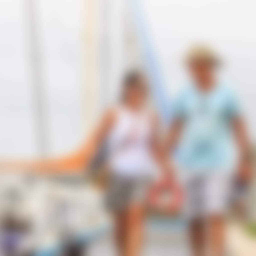 Couple Walking Their Dog Along the Paynesville Pier