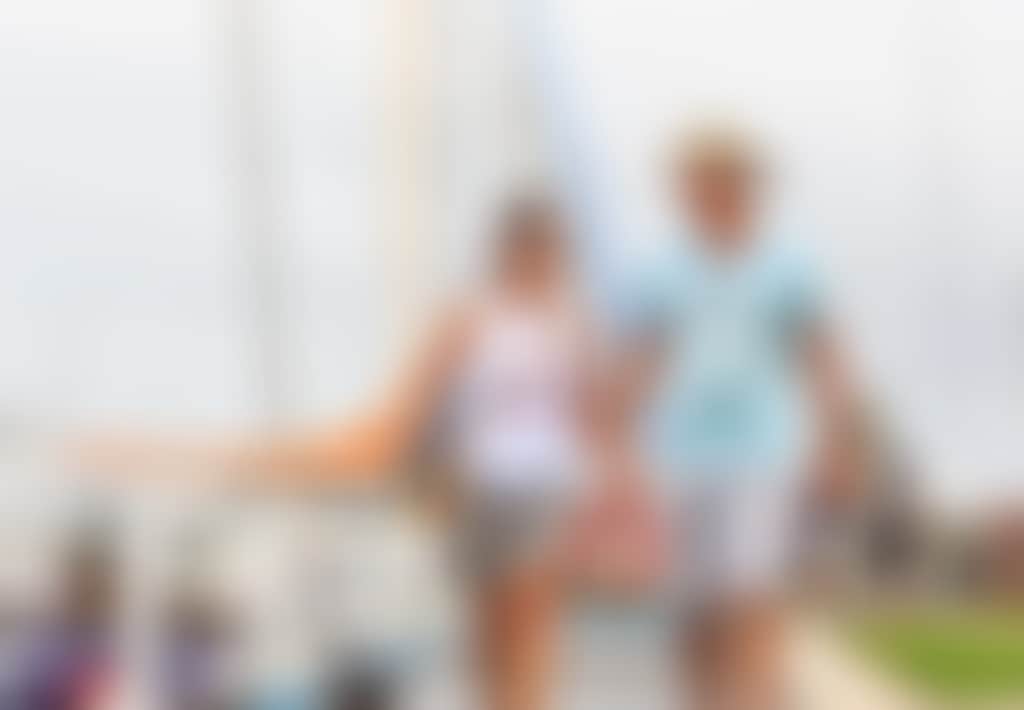 Couple Walking Their Dog Along the Paynesville Pier