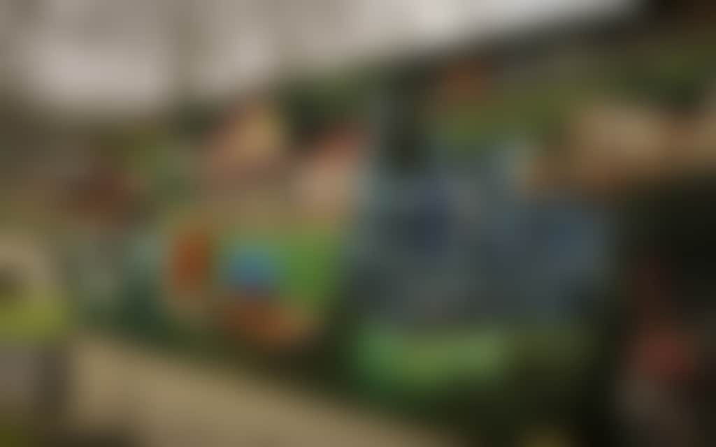 Boolarra mural of train cows and people on building