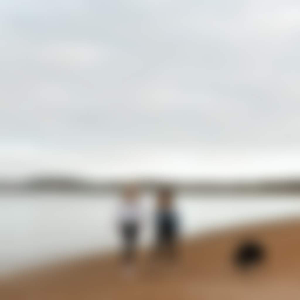 Coronet Bay people walking dog on beach