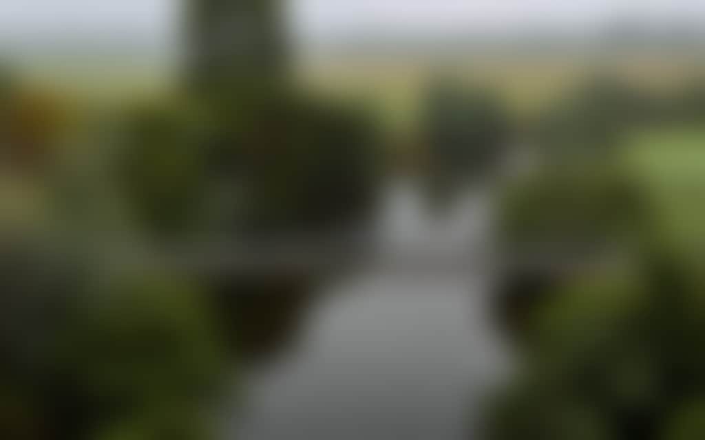 Cyclist crossing the Mtichell River on the narrow bridge Bairnsdale