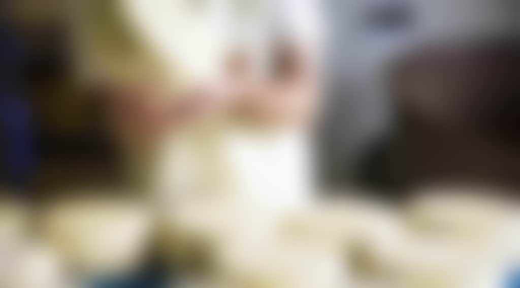 Prom Country Cheese Moyarra worker crafting cheese wheels