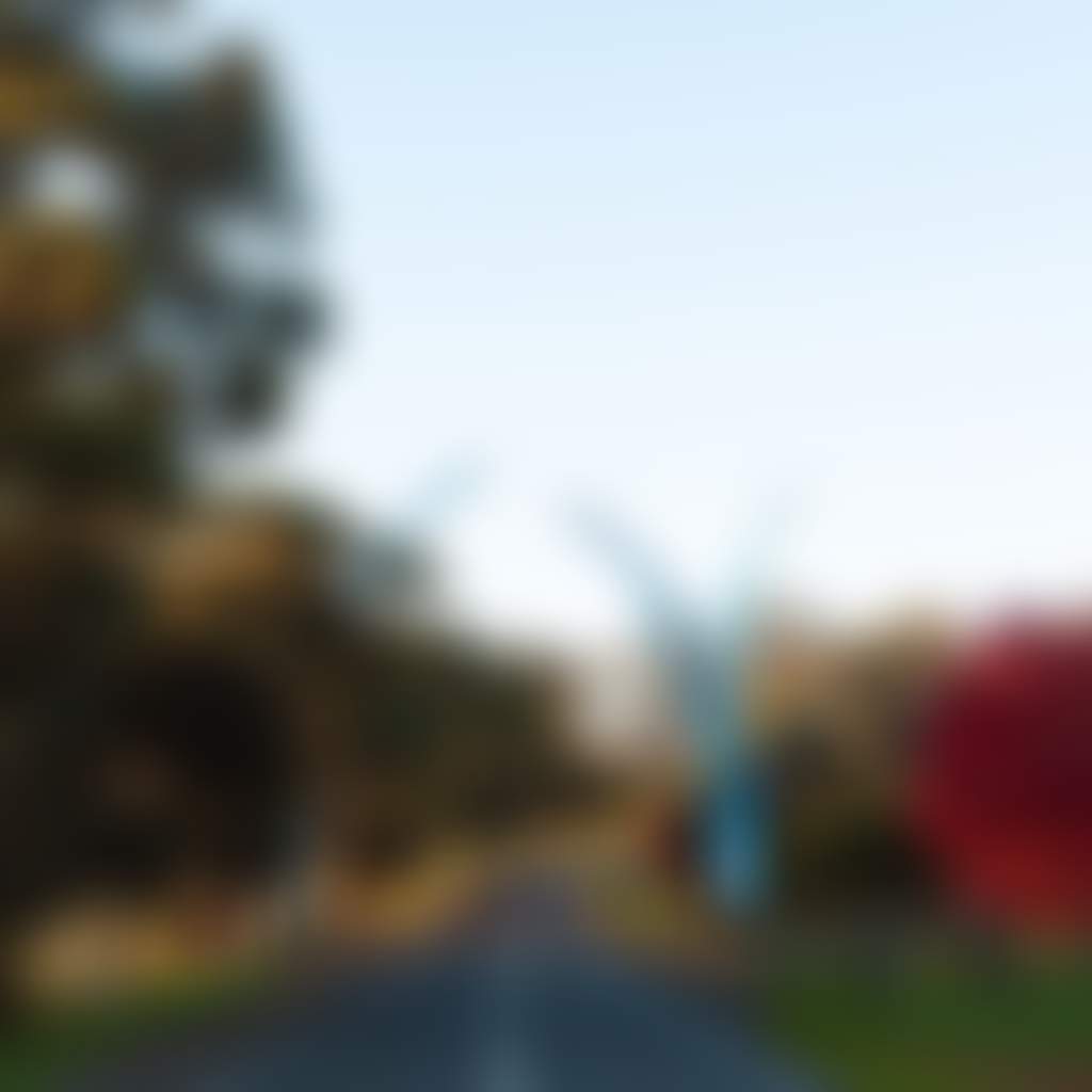 Neerim Bower blue sculpture in Neerim South near autumn trees