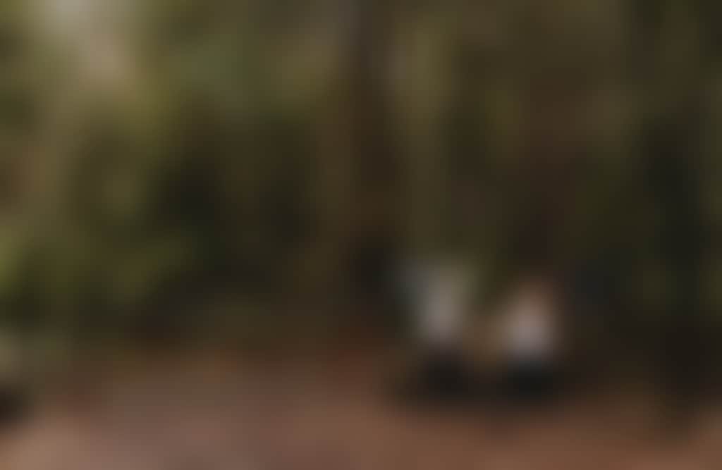 Two people walking past the gate at Nangara Reserve Jindivick